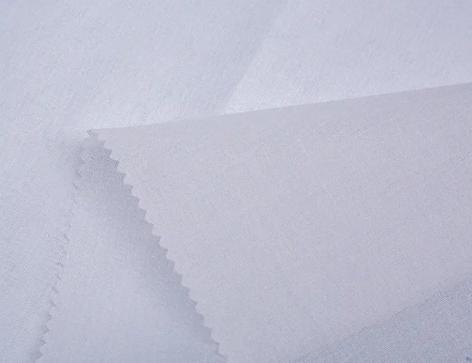 Coton tissé de chemise entrelacée: la quintessence du confort et de la qualité